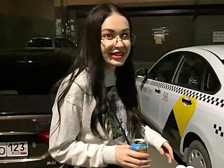 Nerdy babe sucks dick on parking lot