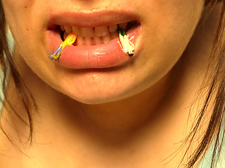 Giantess Girl Unwraps a Candy but Is Surprised Because There Is a Tiny Man in the Candy Bag - She Is Curious to See What It