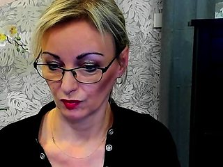 Blonde MILF takes off bra on webcam