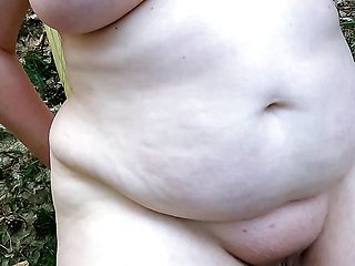 Complete naked in the woods - beating her vagina and tits