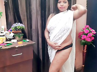 Sensual Indian housewife showcases her collection of sarees and lingerie