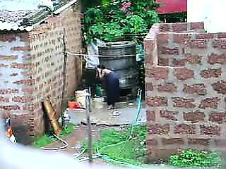 Watch this two hot Sri Lankan lady getting bath in outdoor
