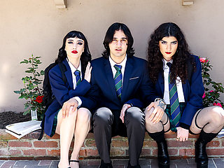 Two goth chicks share a friend's cock on the Halloween