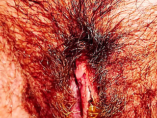 Hairy Pussy in Close-up Peeing a Yellow