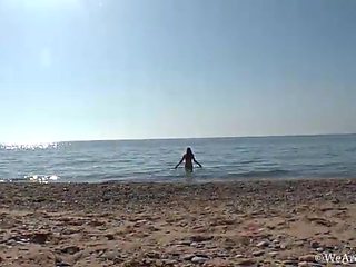 Hairy chick Riana S makes a splash at the beach - WeAreHairy