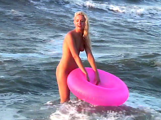 Hot naked blonde on the beach