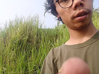 A young man's journey to the rice field where he is urinating again