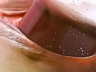Brunette slut controls orgasm while stuffing her pussy with food and toys
