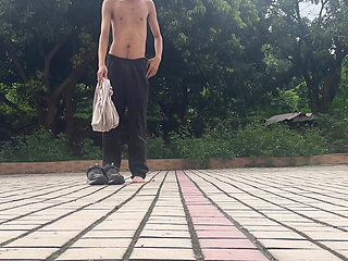 A young man publicly displays his erect penis.