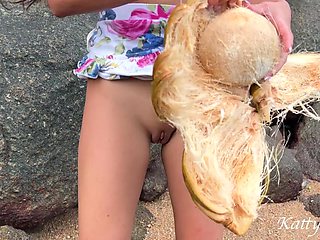 Naked Girl Found a Coconut on a Beach and Poured the Juice Over Her Body