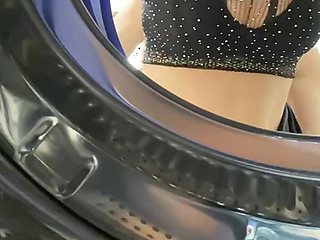 Hot busty girl trapped in the washing machine and stuffing it