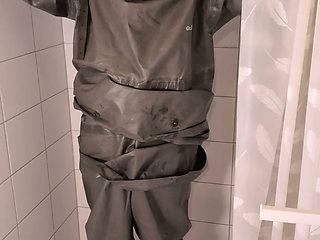 Undressing sweaty heavy rubber Zodiac Zodiak hazmat suit with rubber gloves, boots, plastic pants, gas mask