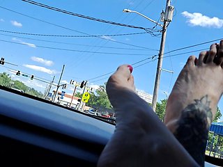 Bare Feet on Dashboard in Moving Car