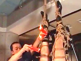 Roped asian pregnant slave gets wax dripped on her