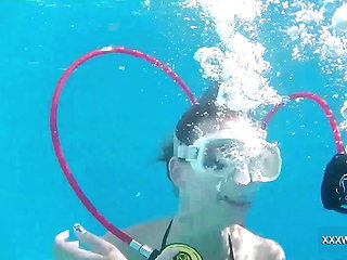 Minnie has fun with Candy underwater