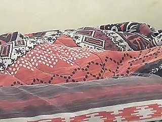 Deep Kissing While Playing with a Strange Object Under the Duvet