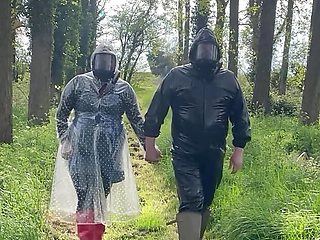 Plastic raincoat and gasmask in the woods
