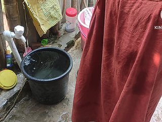 Indian Woman Washing Outside