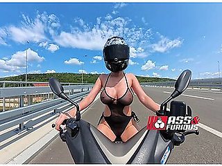 Riding Motorcycle In See Through Beach Wear