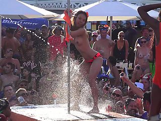 Mature Blondie flaunts her fakes in a skimpy bikini at the beach