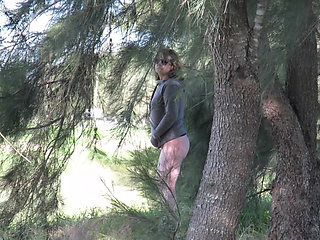 Patricia and her ass walks among the pines