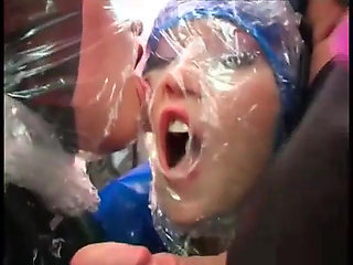 Two slutty slaves in latex sucks a hard big cock