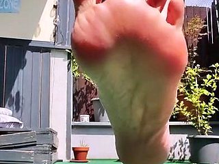 Outdoor solo scene with Ivana masturbating her pussy