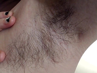 Long dark hairy armpits closeup