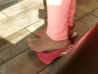 Shoeplay with High Heels in a Bar