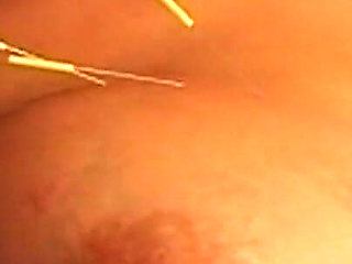 Busty Blonde MILF Submits to Intense Needle Play