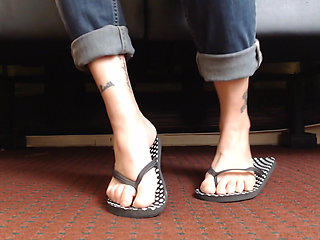 Dotted flipflop shoe play closeup