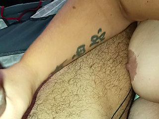 A young blonde jerks off a guy .he caresses her big breasts and her beautiful pink nipples