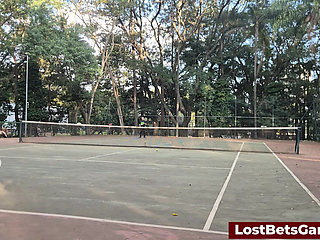 An outdoor strip tennis match with Rafaela and Igor
