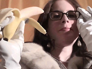Spex brunette talking dirty while eating banana