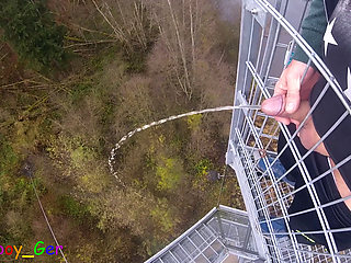 I pee outside from a very public observation tower and then masturbate my penis, and my balls are fat. But then people...