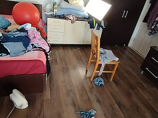 Sexy brunette doing naked chores around the house.