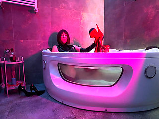 Mistress' Taking a Bath in Latex and Boots
