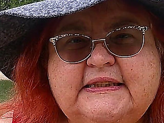 Nurse Vicki Smoking in the Park on a Bench All Dressed up