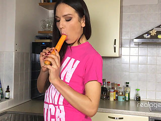 Playful Young Burnette Nataly Gold Prepares Carrot in Proper Way