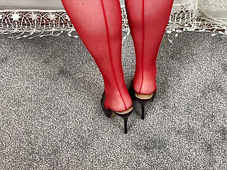 Mrs Mature Feet wearing her sexy red fishnet hold ups and wearing her waspie