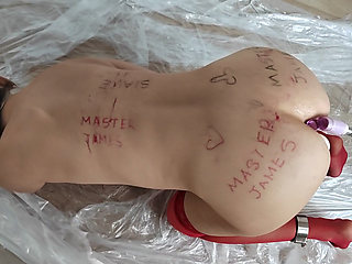 The female slave is bent over for her master's pleasure.