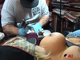 Shyla Stylez gets tattooed while playing with her boobs