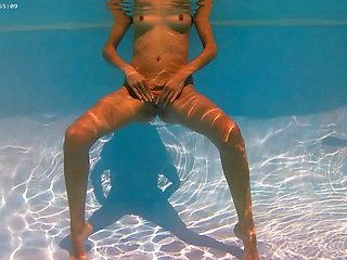 Outdoor sexy nude swimming by exhibitionist girl