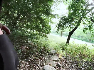 Exposes a big hairless foreskin in the woods.