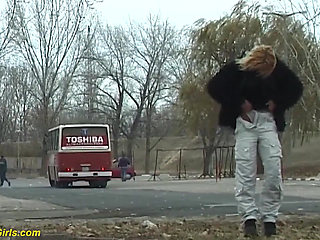 Young girl pissing on street