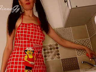 Hot housewife sexually rustles her apron in the kitchen