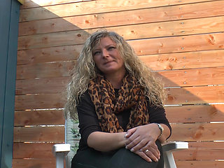 Busty Germans slut plays with a big orange dildo