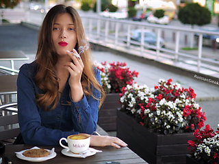 Magnetic Russian Beauty Playing with Cigarette Smoke