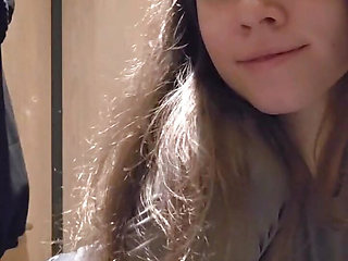 Charming girl teases you very quietly in a public toilet