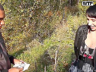 Slutty brunette sucks a dick for the money in the forest